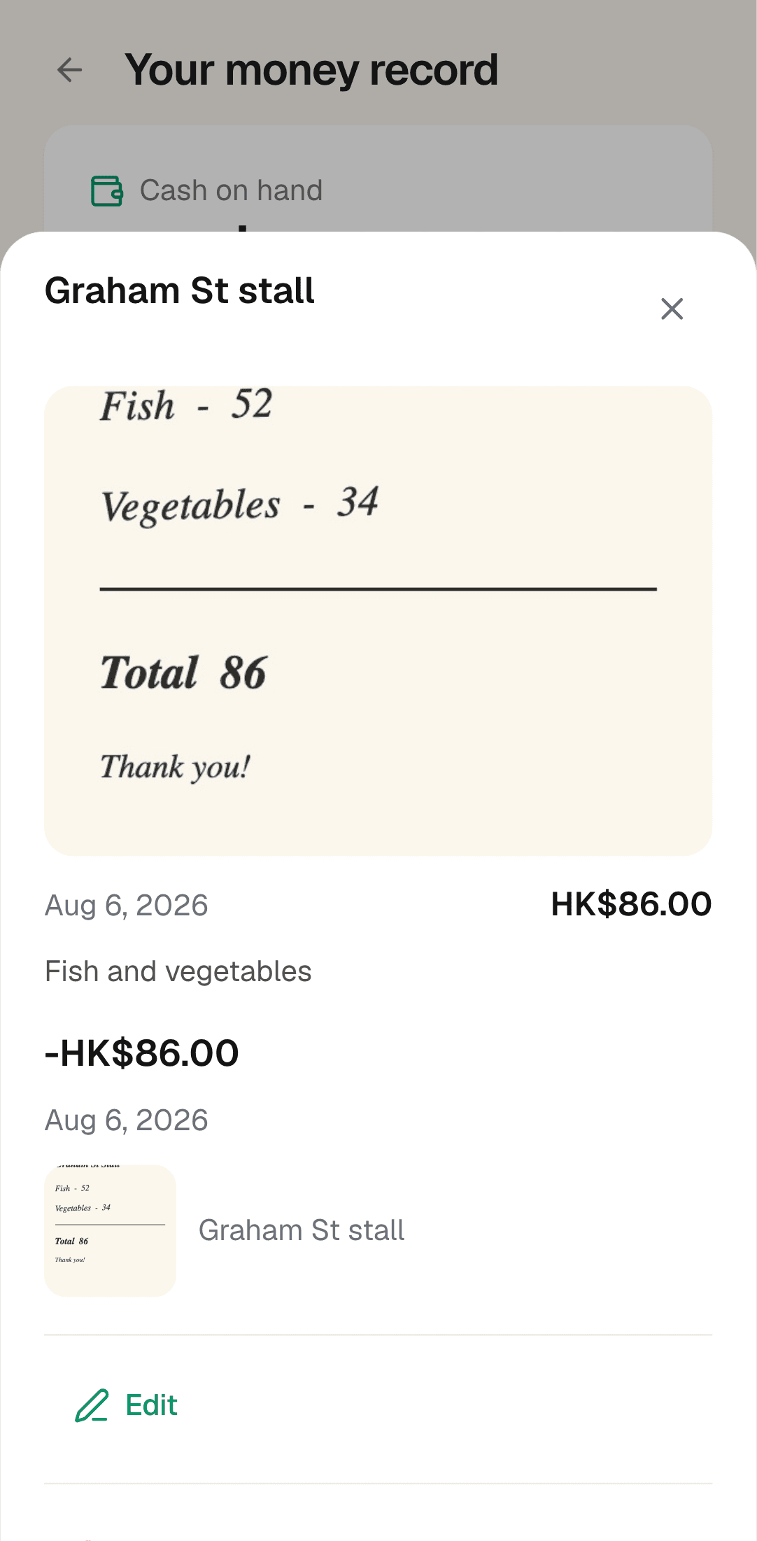 A handwritten stall note photographed into SamaKasa — fish 52, vegetables 34, total 86 — kept as a HK$86.00 spend from Graham St stall with the helper's note beside it.